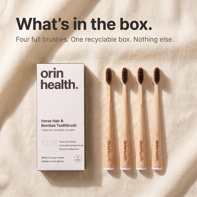 The OrinHealth Kindred box holding four bamboo toothbrushes